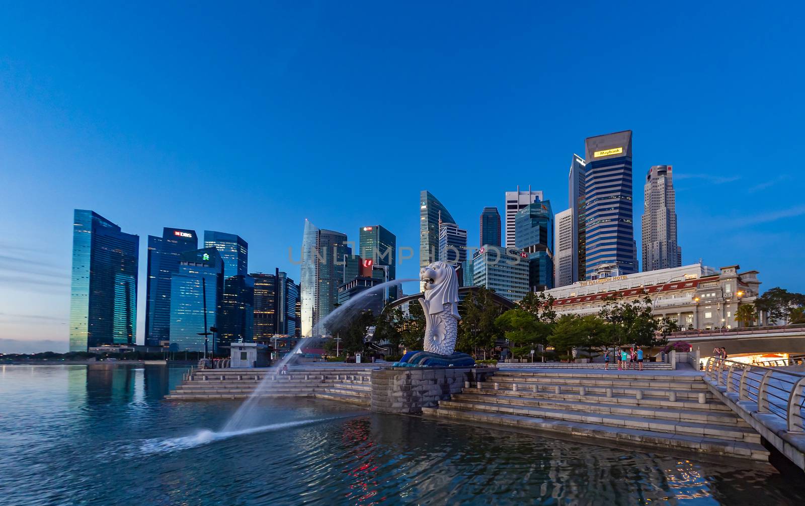 SINGAPORE CITY SINGAPORE: FEBRUARY 15 2020: Singapore Merlion Park downtown Singapore  business district at sunrise