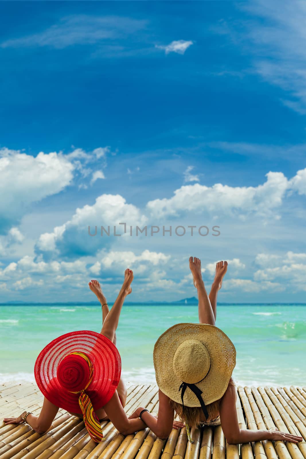 Two beautiful women enjoying the tropical beach in Thailand