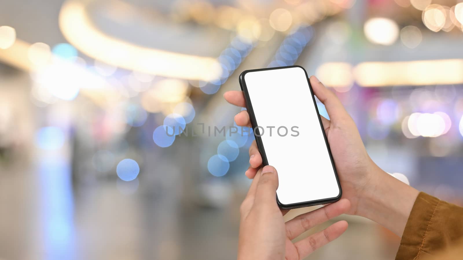 Close-up image of woman hand while using/holding a white blank s by prathanchorruangsak