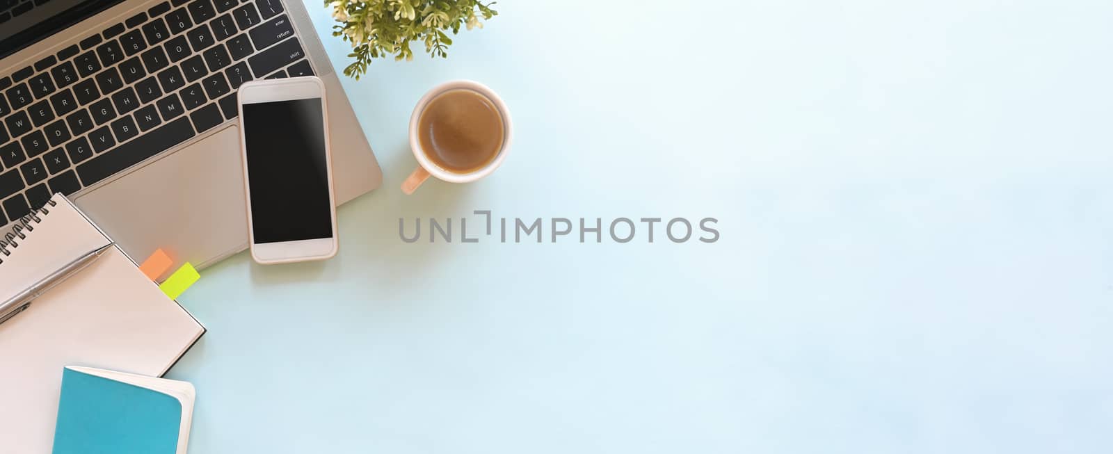 Simple Top view table - Creative flat lay office desk. Laptop, notebooks and coffee cup on white background. Panorama banner blue background with copy space.