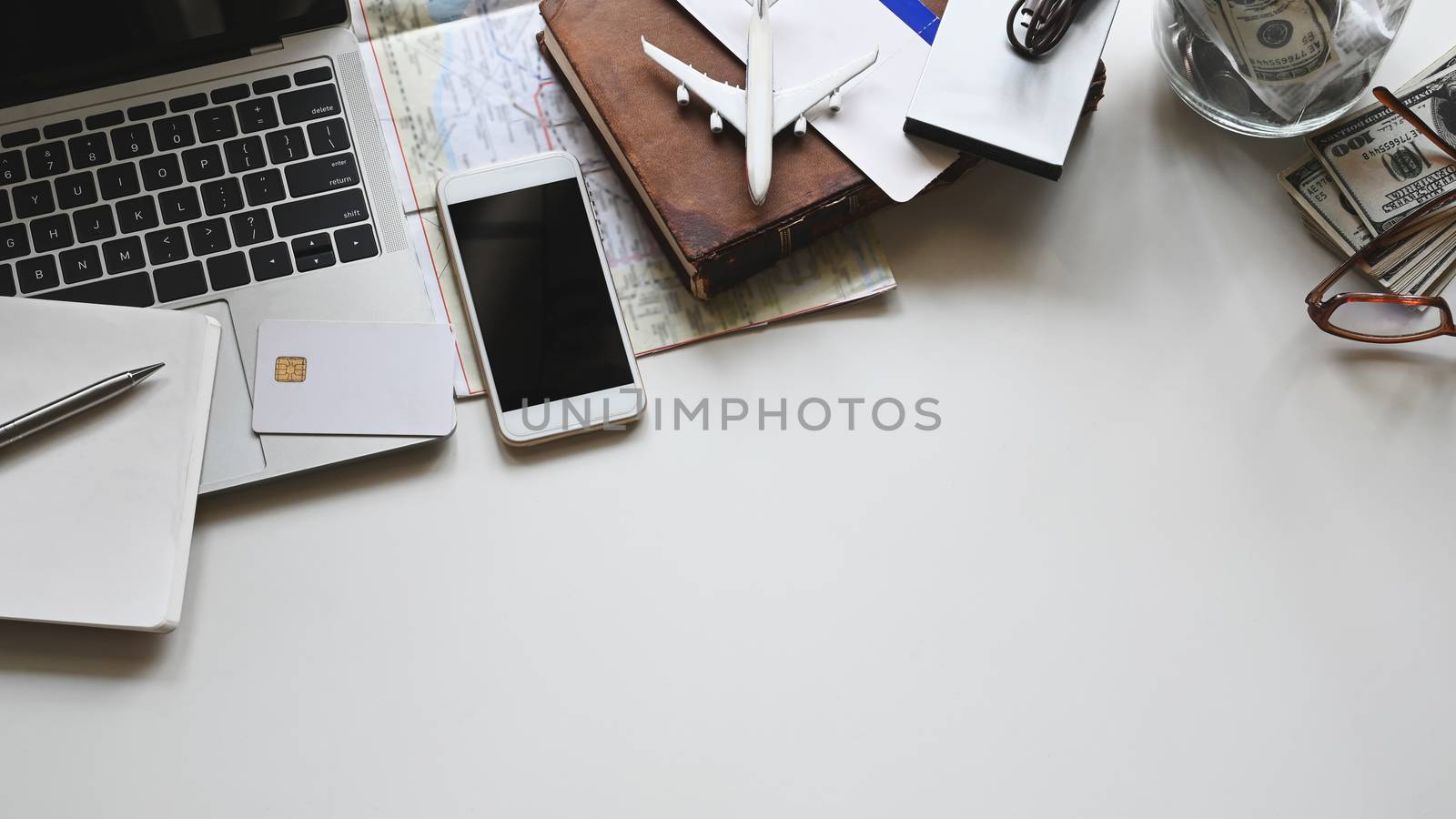 Travel stuff on the white table. Vacation travelling concept.