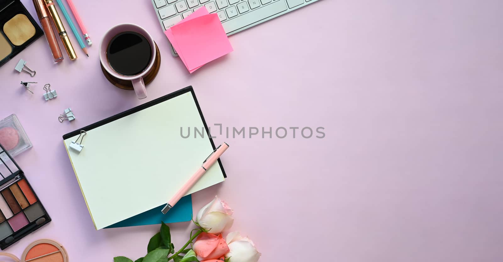 Top view image of feminine working desk including coffee cup, mo by prathanchorruangsak