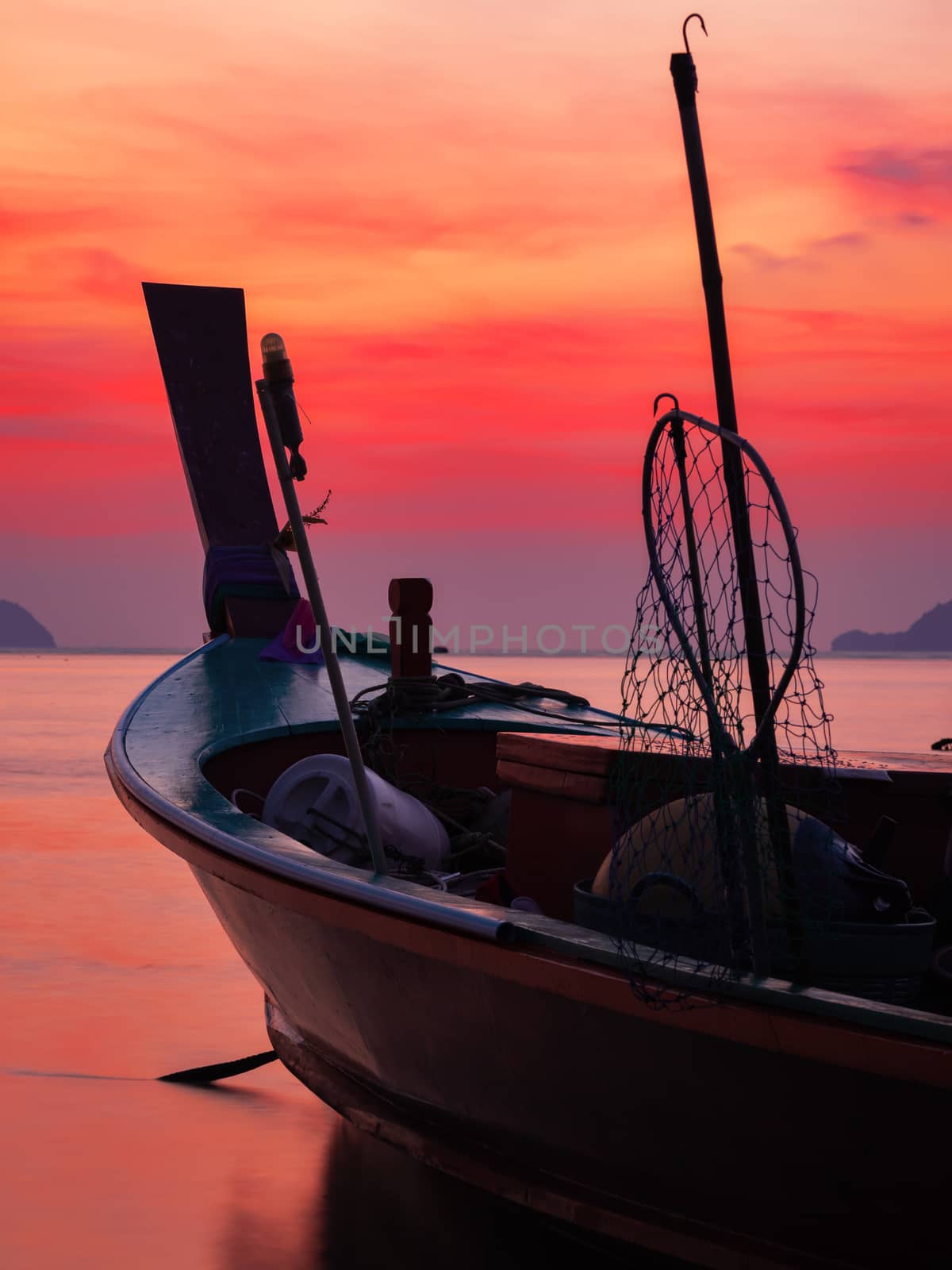 Traditional long-tail boat on the beach in Thailand