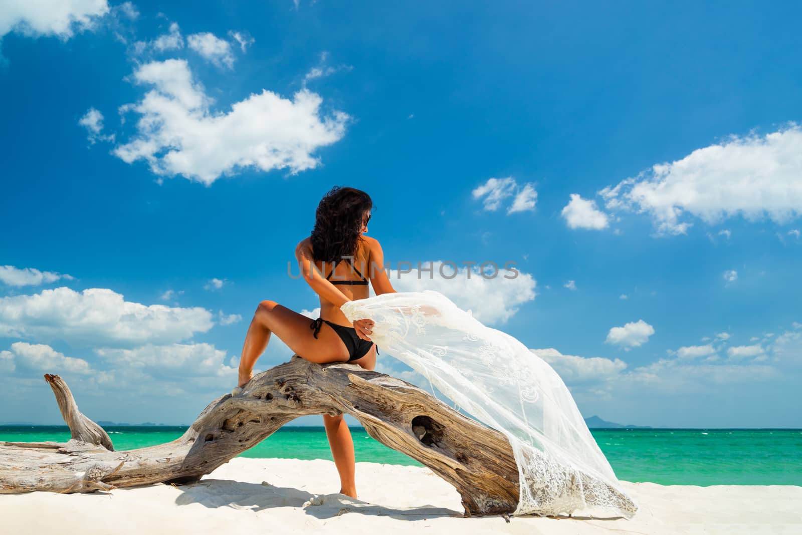 Woman enjoying her holidays at the tropical beach in Vietnam - UNRETOUCHED body.