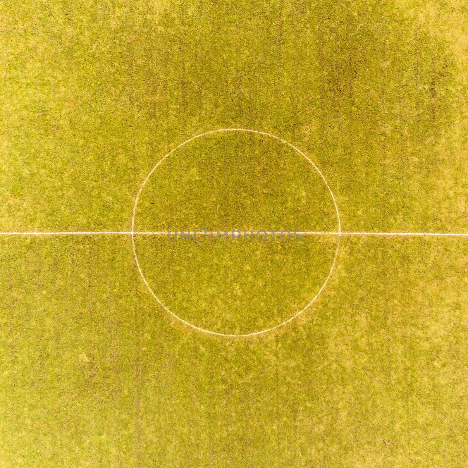 Aerial view of the middle circle of a football field of a district league team in a village in the heath by geogif