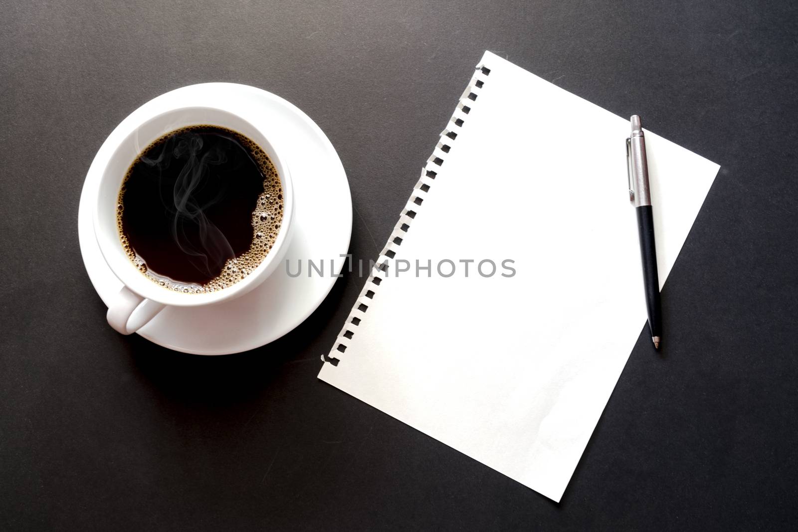 Empty paper sheet , cup coffee and pen on Black background, paper note for add text message.