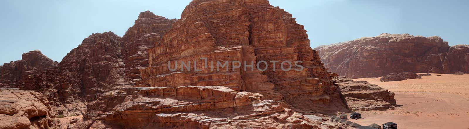 Composite panorama of high resolution aerial photos of a monolithic mountain in the central area of the desert reserve of Wadi Rum, Jordan, middle east