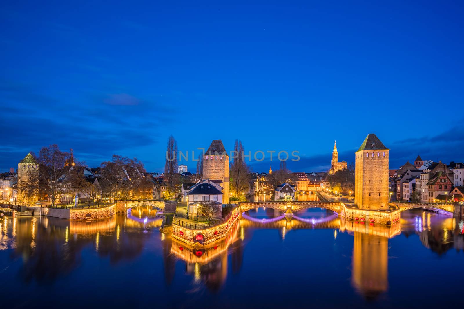 Tourist area "Petite France" in Strasbourg, France and covered bridges at night