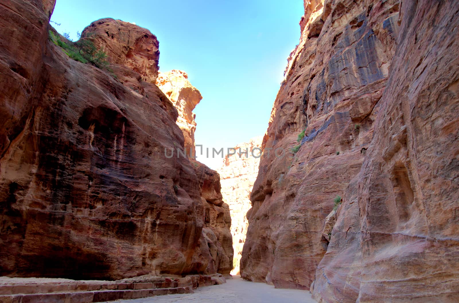 View front from the interior of the Siq leading into the new seventh wonder of the world of Petra in Jordan, middle east