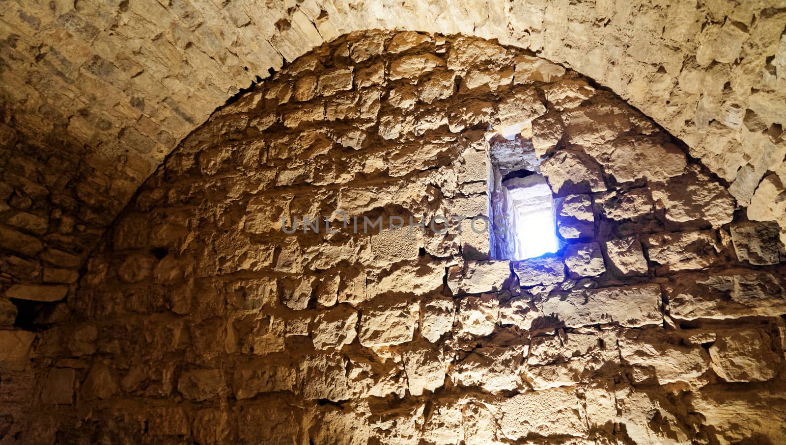 End of a passage through the fortress of Karak, Jordan, with a small window at the upper end of the wall by geogif