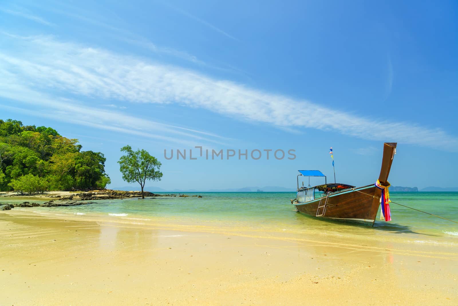 Traditional long-tail boat on the beach in Thailand