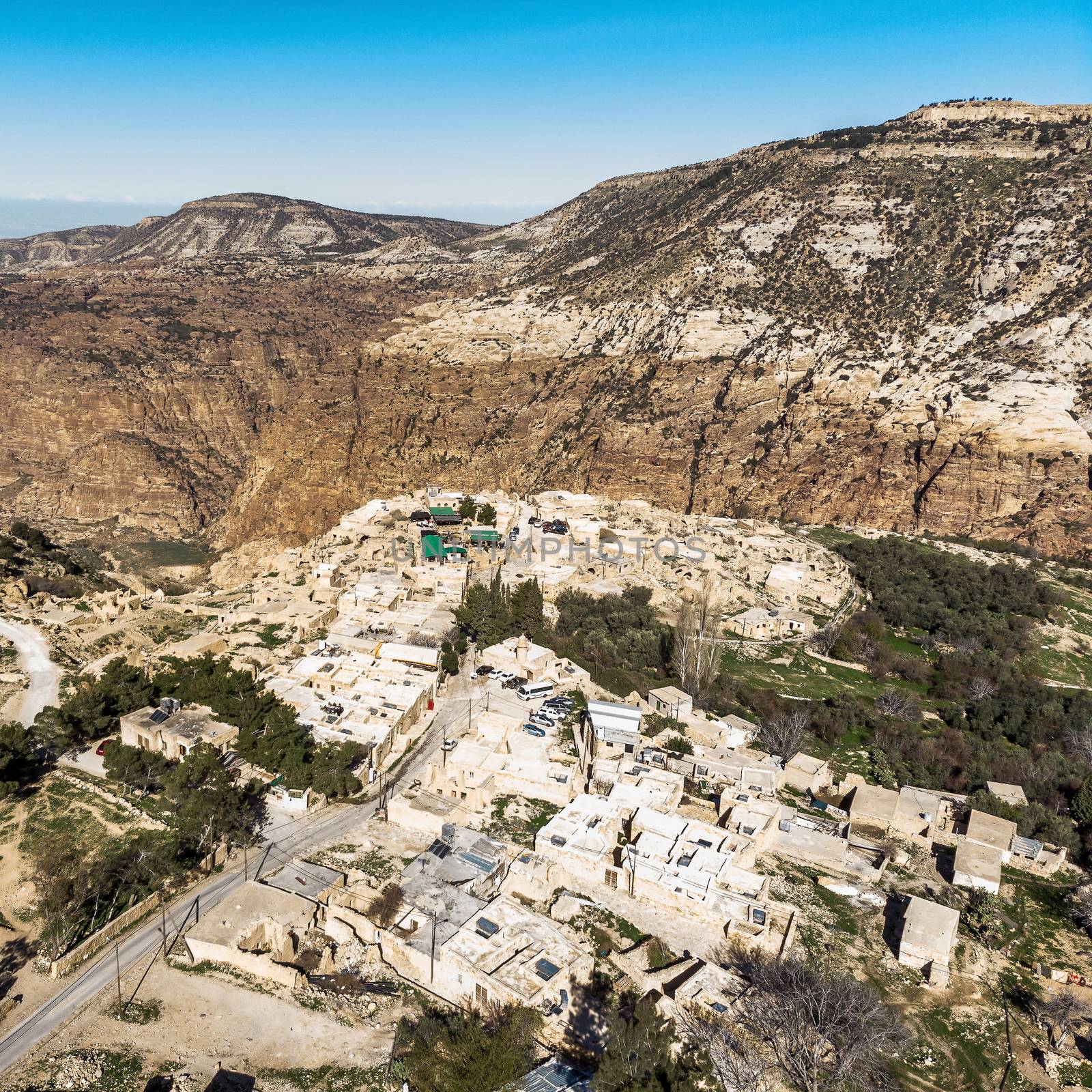 Oblique aerial view of Dana Village at the entrance of the biosphere reserve of the Dana Valley, north of Petra by geogif