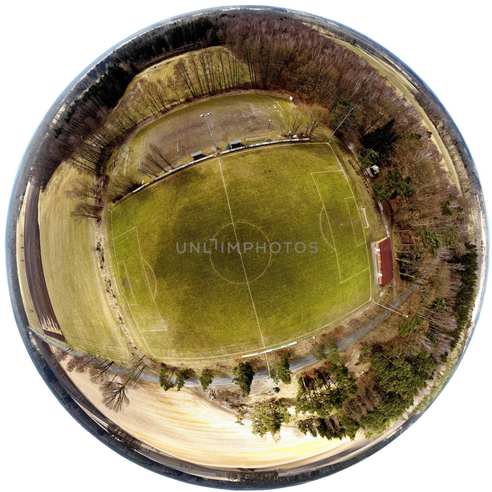 Spherical panorama from composite aerial photos of a football field in a village in the heath, made with drone