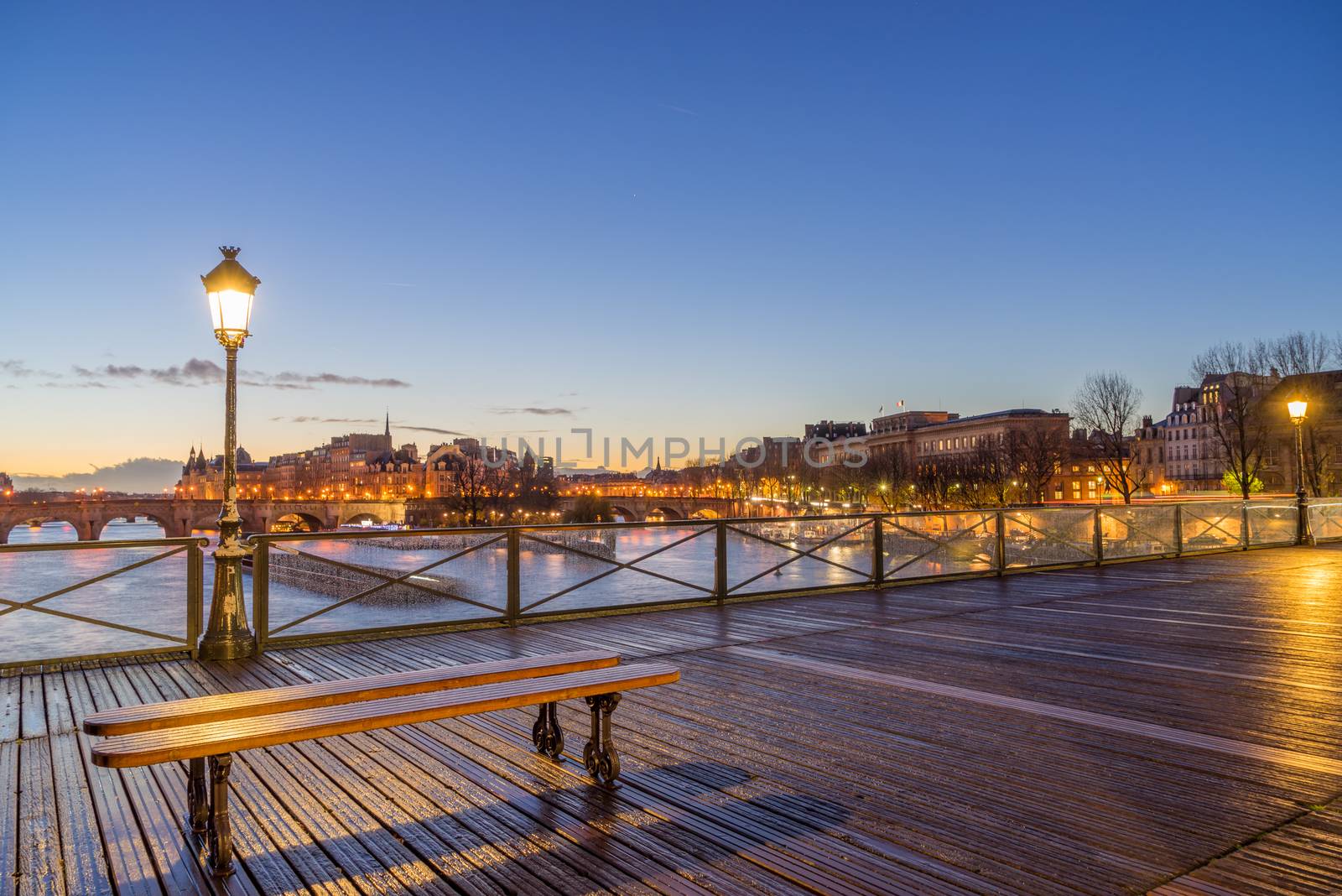 River Seine with Pont des Arts at sunrise in Paris, France