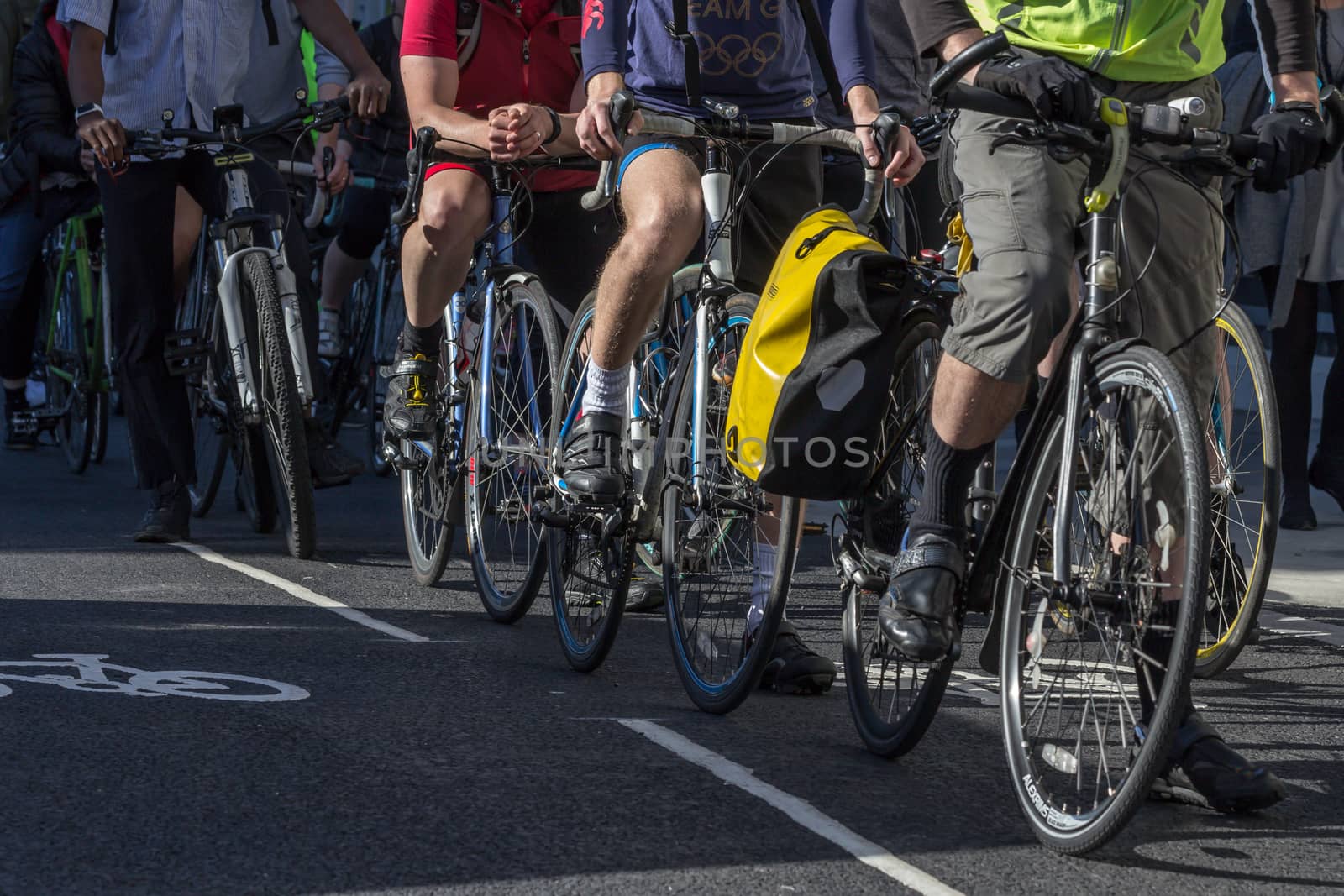 London cyclists commuting along a cycle lane during the morning rush hour