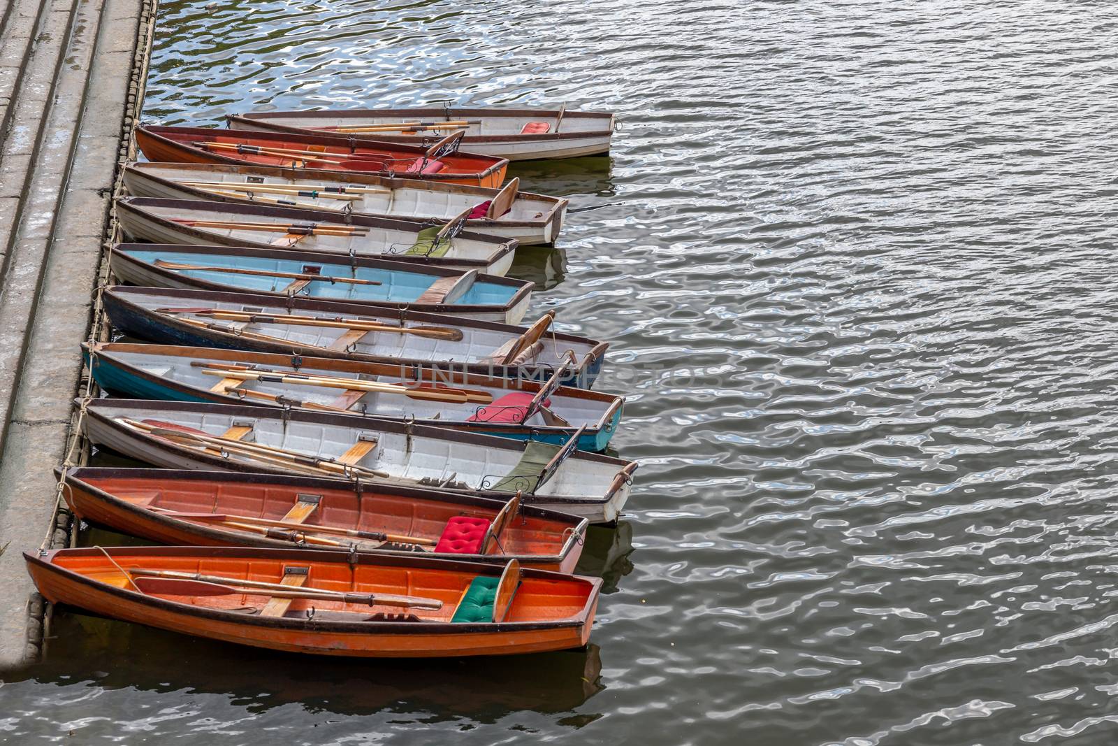 Wooden boats for hire moored on the River Thames by magicbones