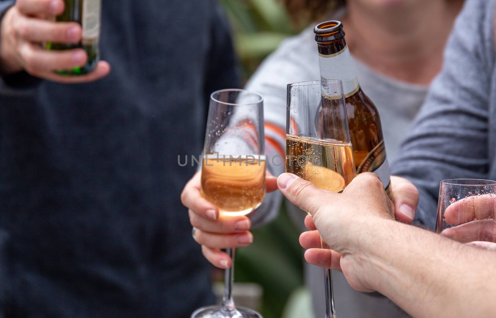 Friends toasting with drinks by magicbones