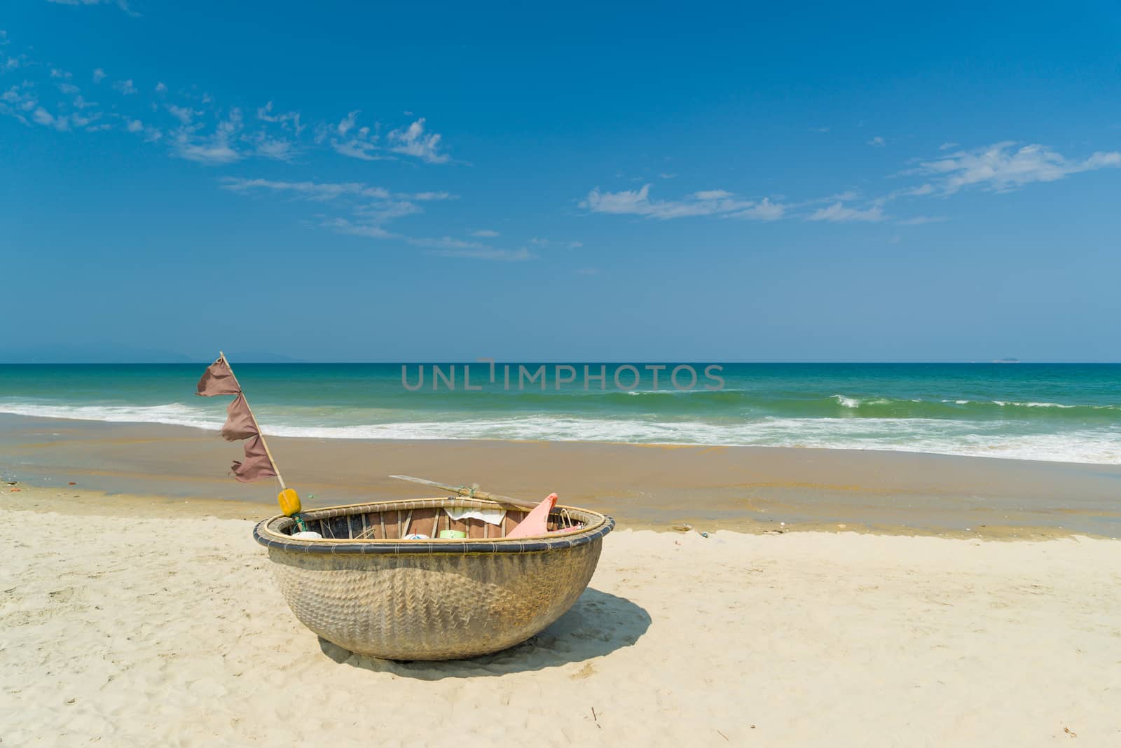 Traditional fishing boat on the beach of Hoi An Da Nang Vietnam