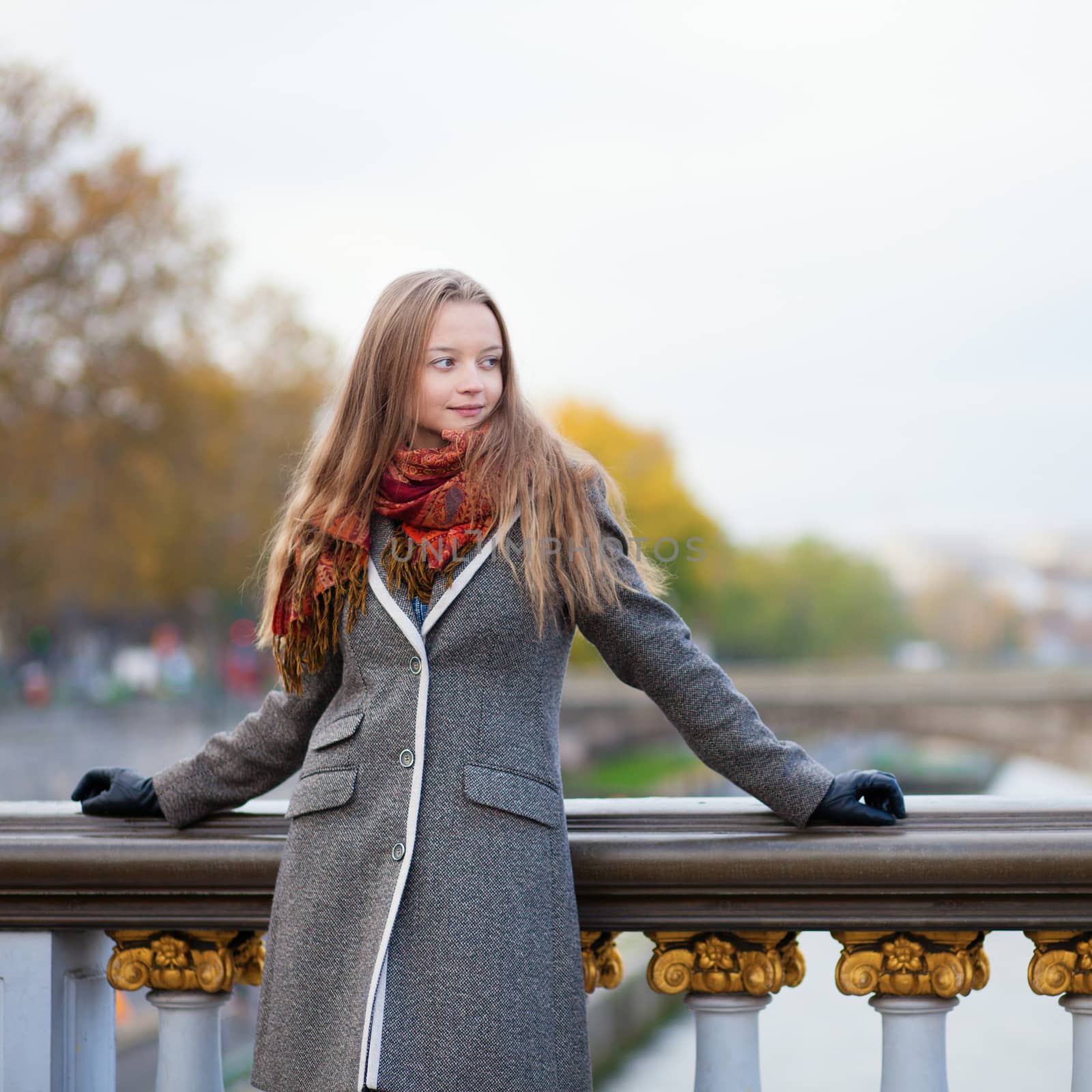 Beautiful young lady in Paris on a bridge by jaspe