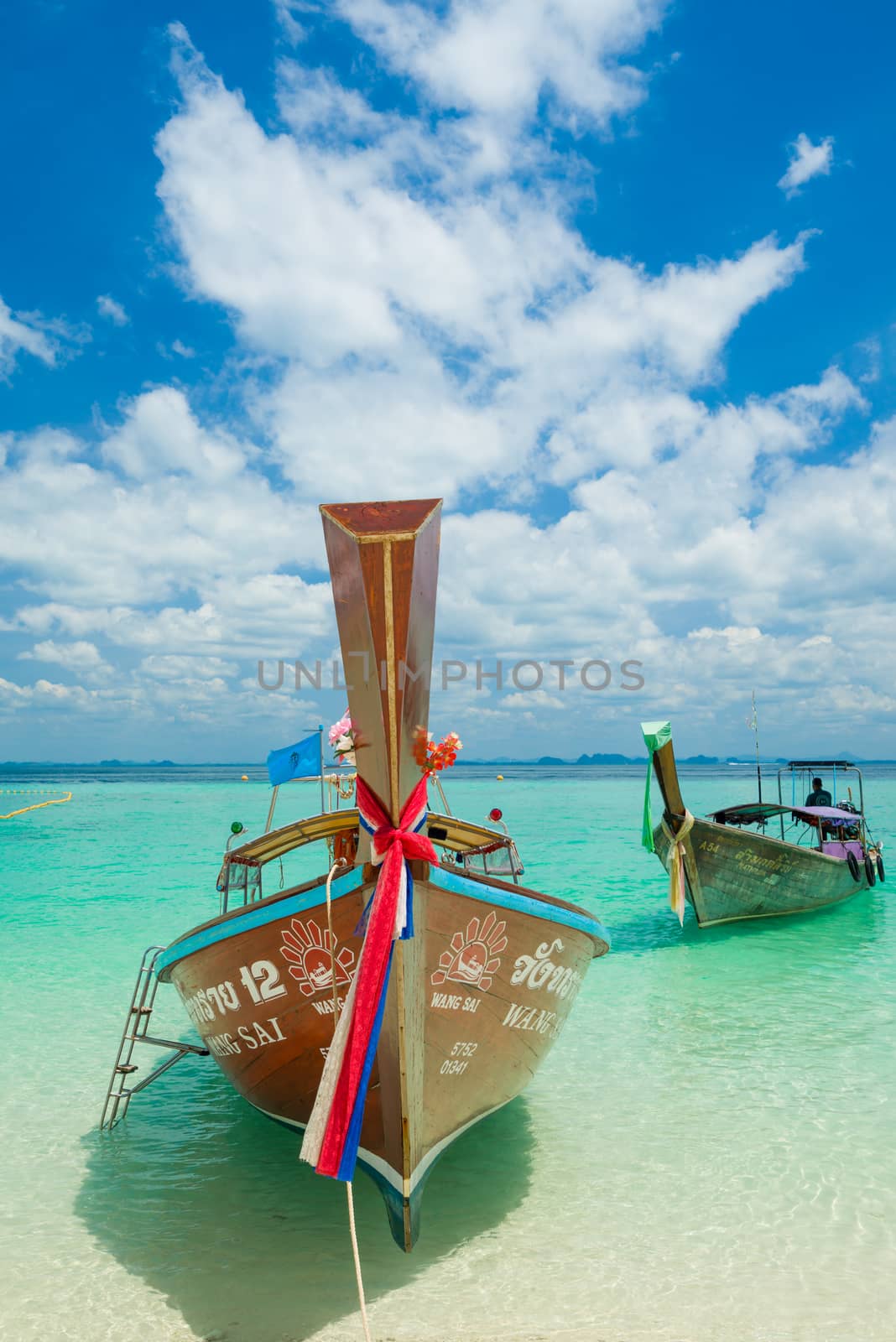 Traditional long-tail boat in Thailand by Netfalls