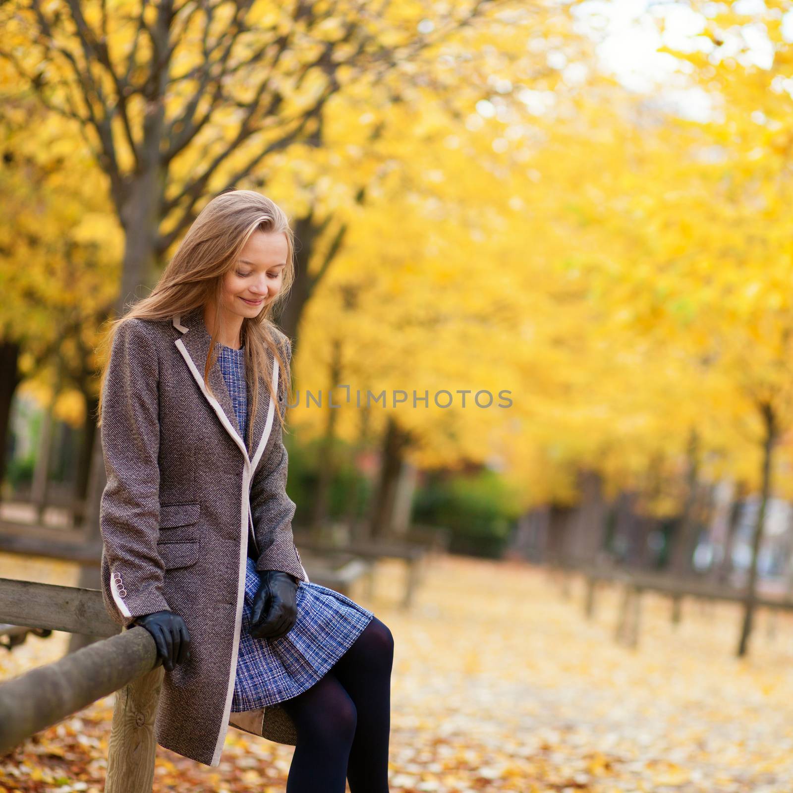 Girl enjoying beautiful fall day by jaspe