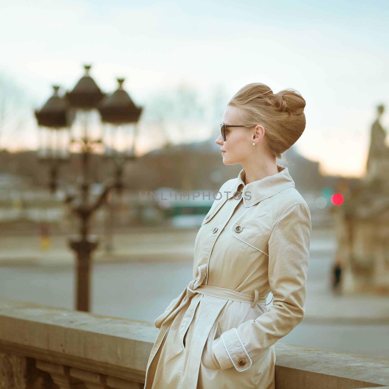 Elegant young Parisian woman outdoors. by jaspe