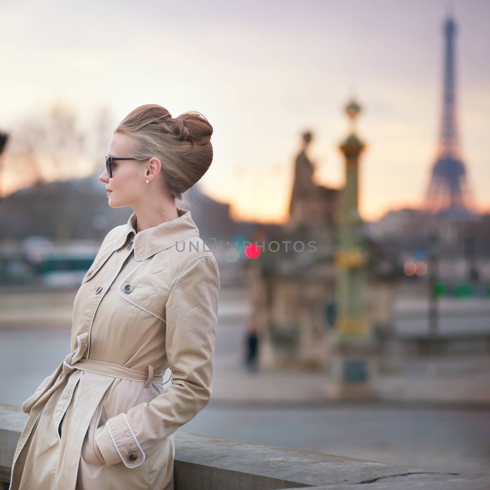 Elegant young Parisian woman outdoors.