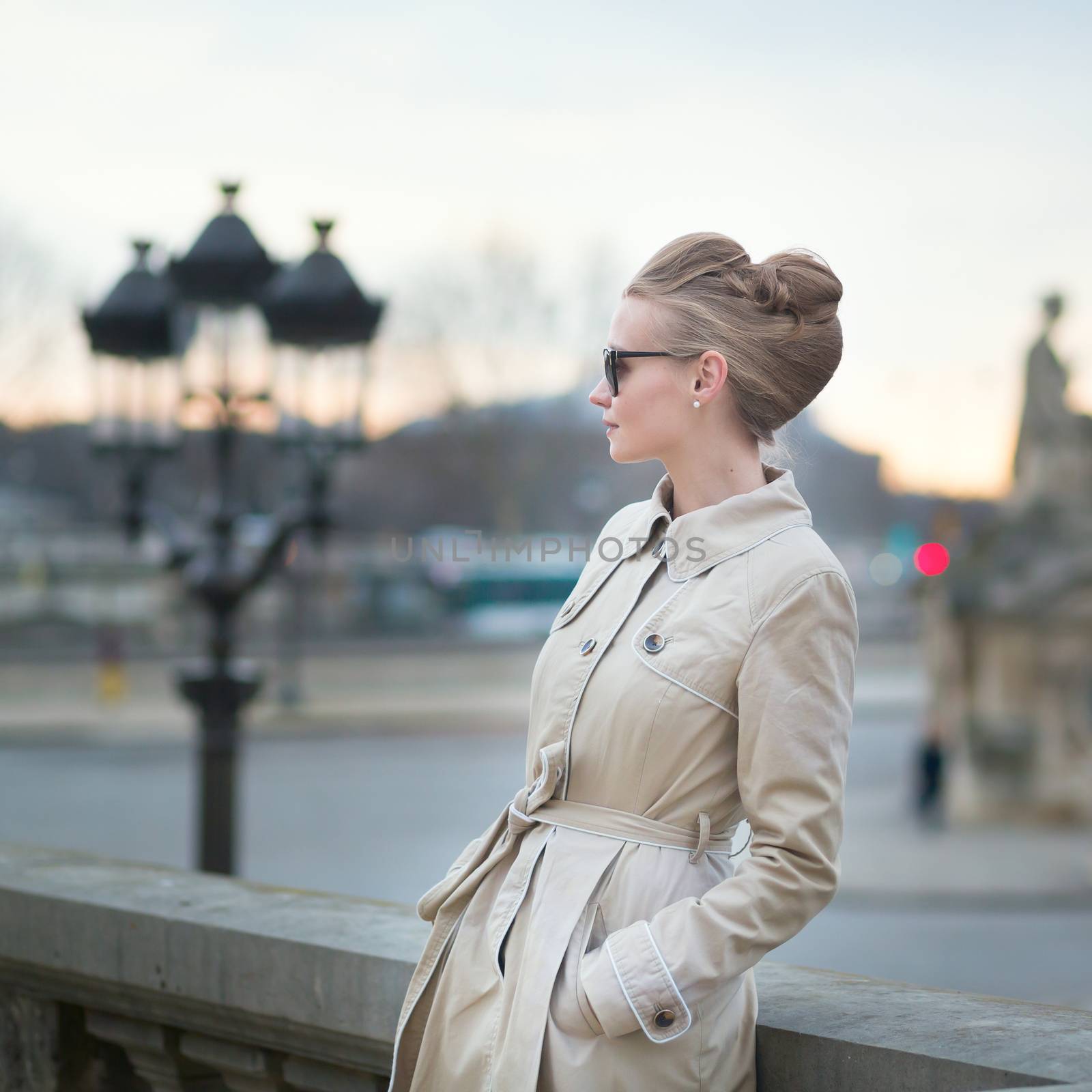 Elegant young Parisian woman outdoors by jaspe