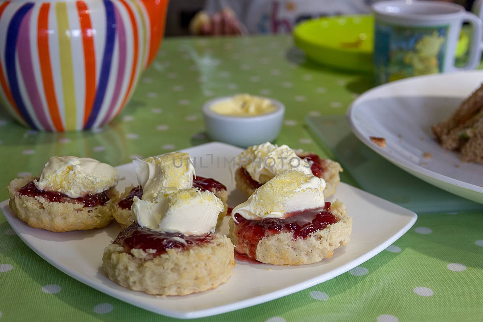 Cornish cream tea scones. Traditionally cream tea scones in Cornwall are served on a Cornish split, a sweet bread roll, with jam then cream on top.