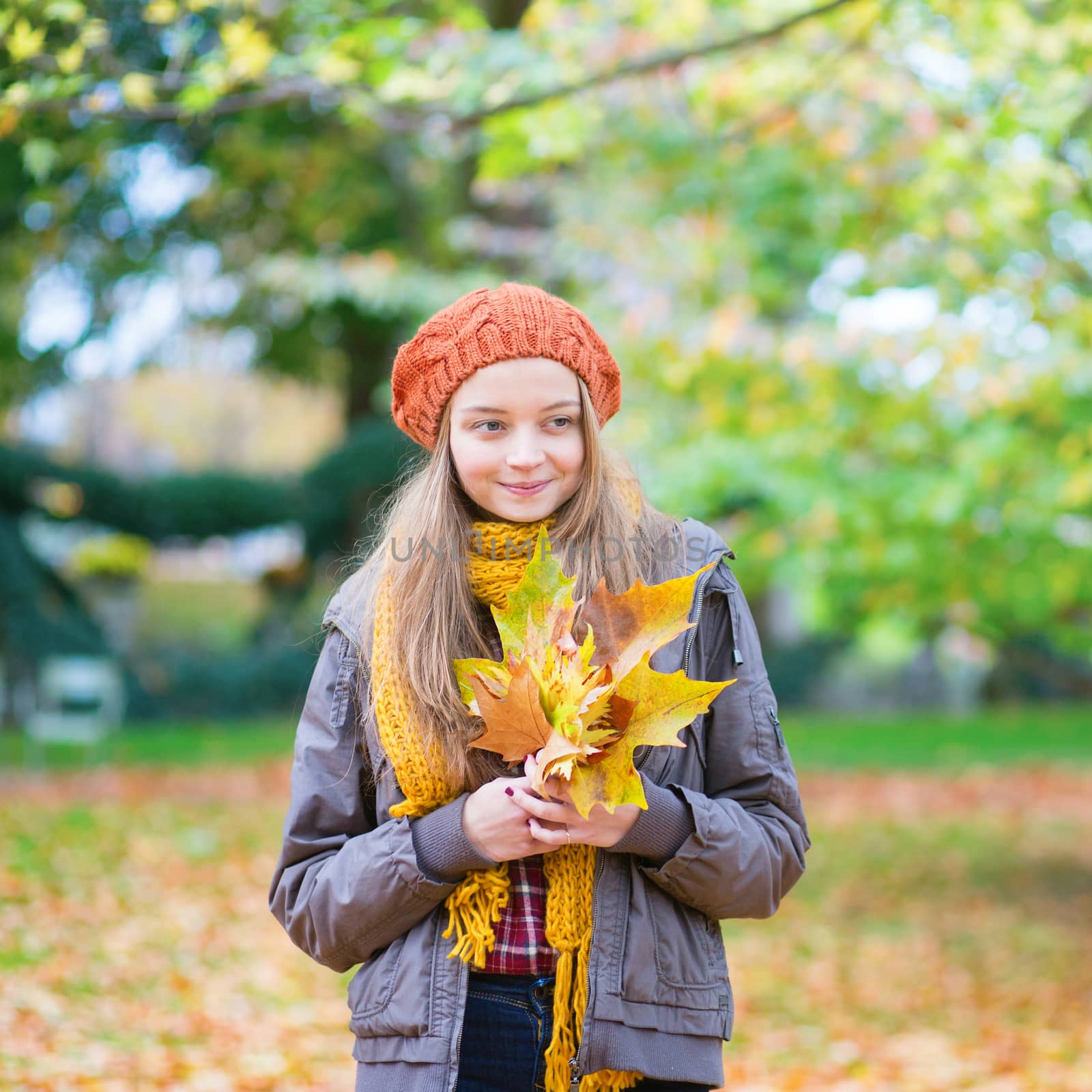 Happy young girl on a fall day by jaspe