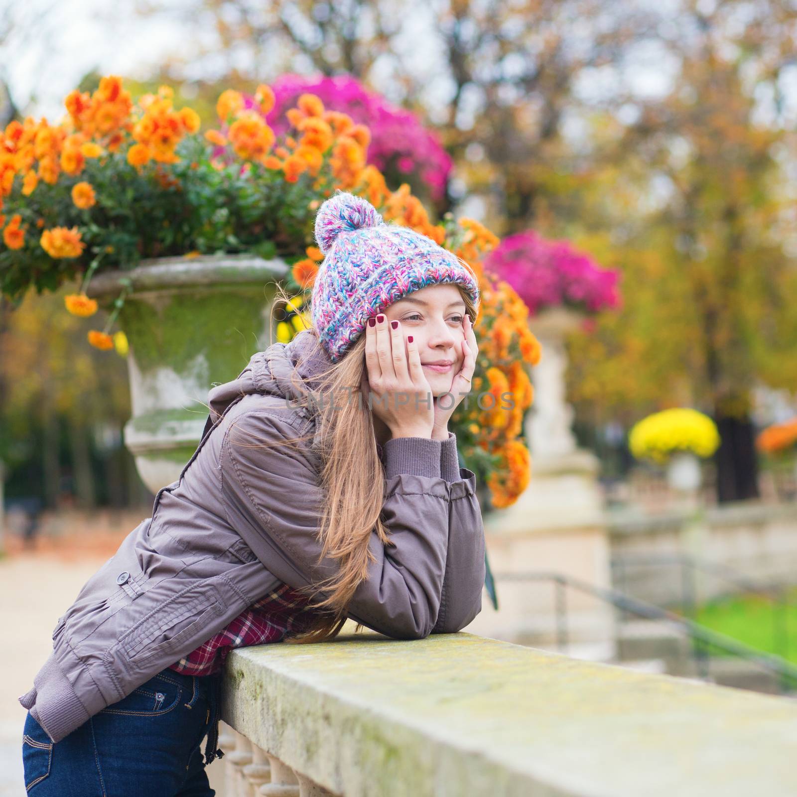 Young Parisian girl in park by jaspe