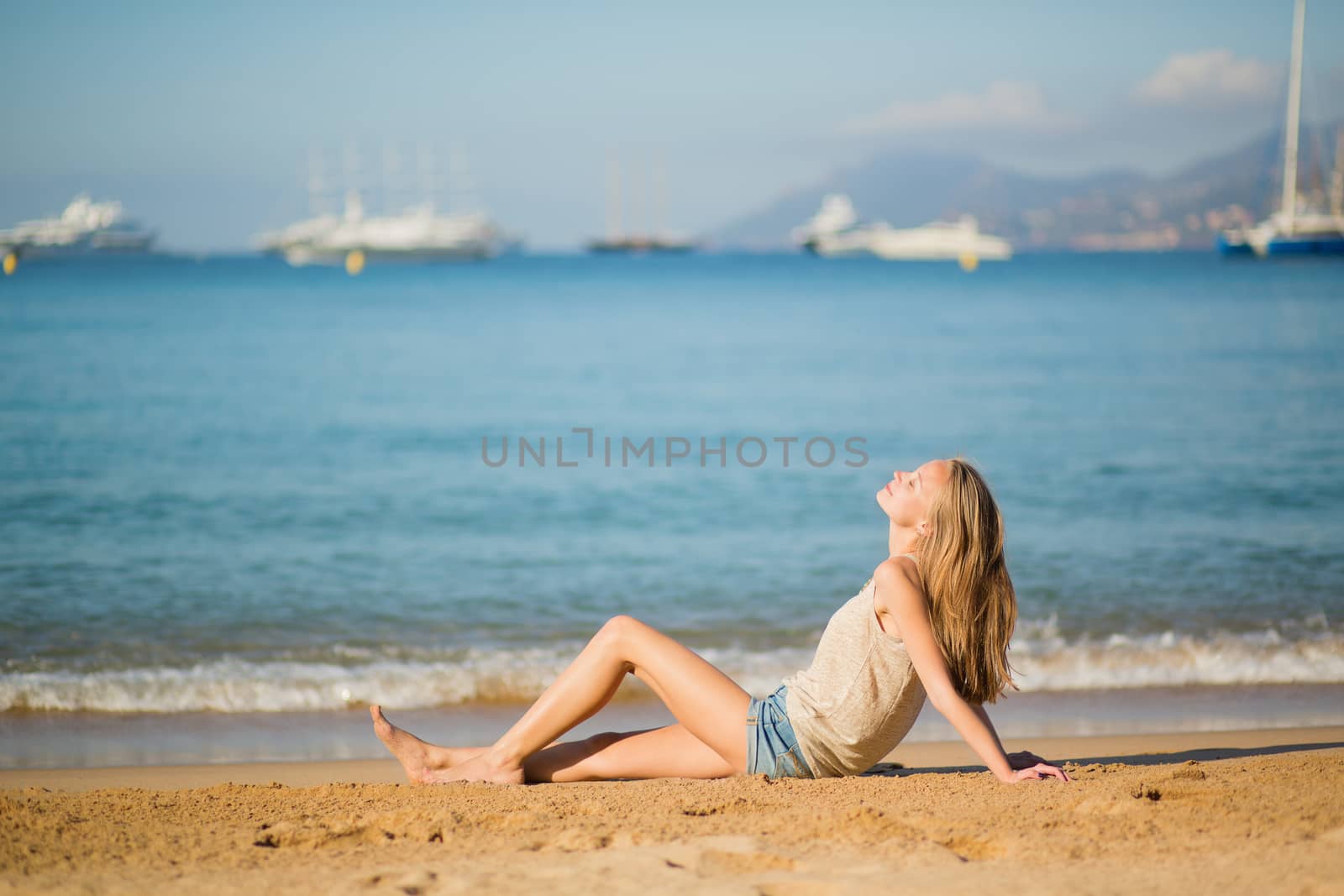Beautiful young woman relaxing on the beach