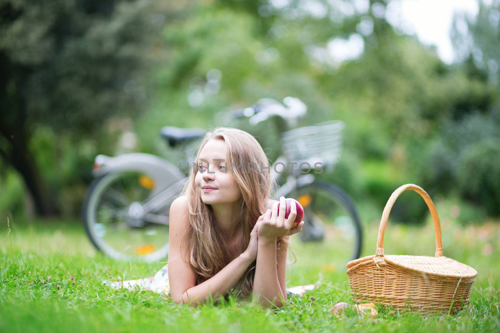 Beautiful young girl spending her time in the countryside