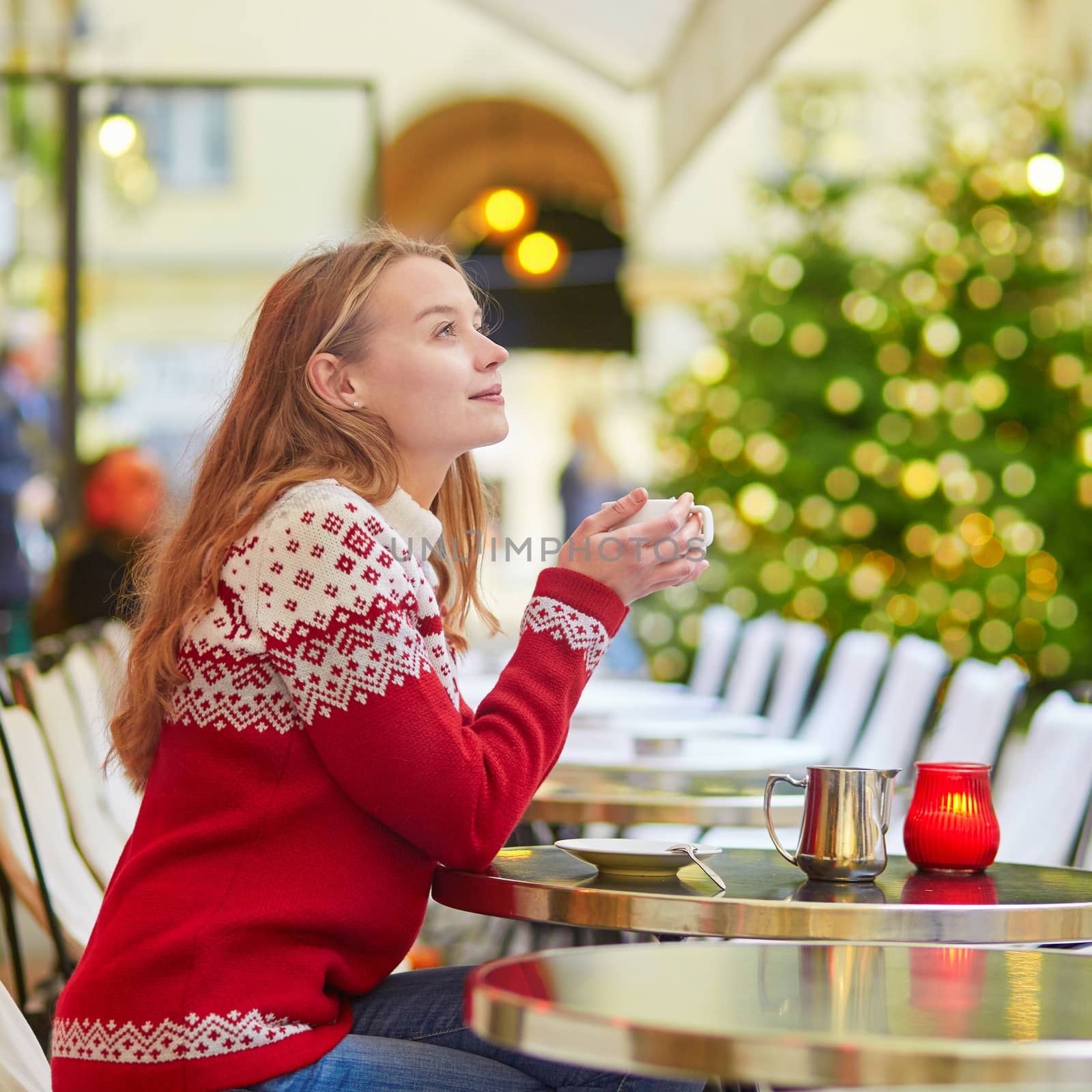 Beautiful young girl in an outdoor Parisian cafe by jaspe