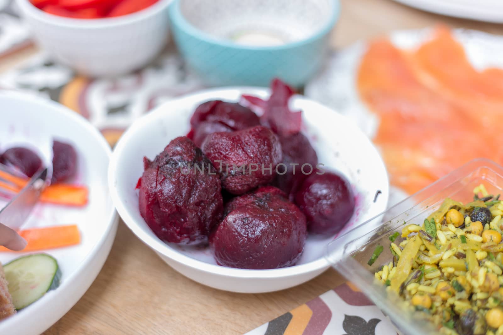 Bowls with salad ingredients on table by magicbones