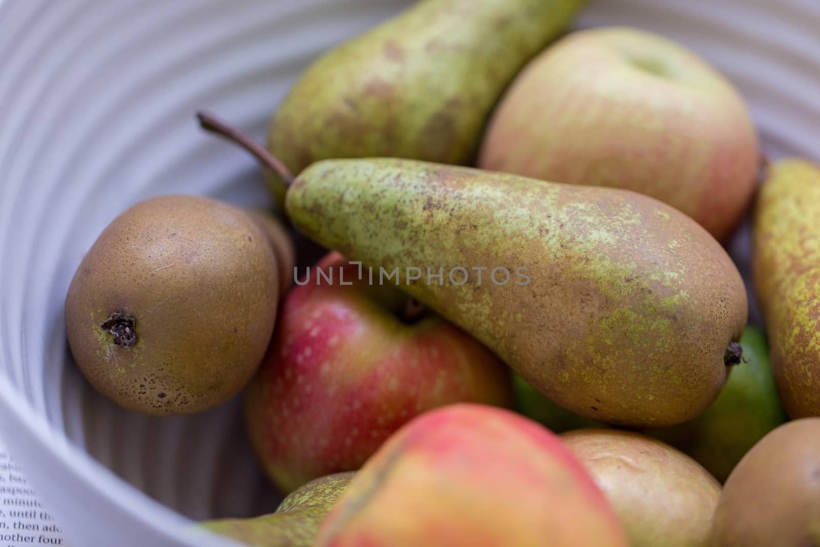 Apples and pear fruit in a bowl