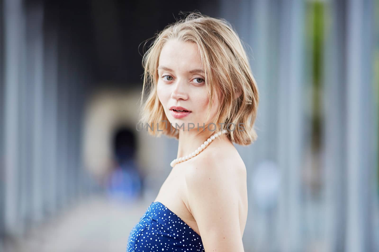Beautiful young elegant French woman in Paris outdoors