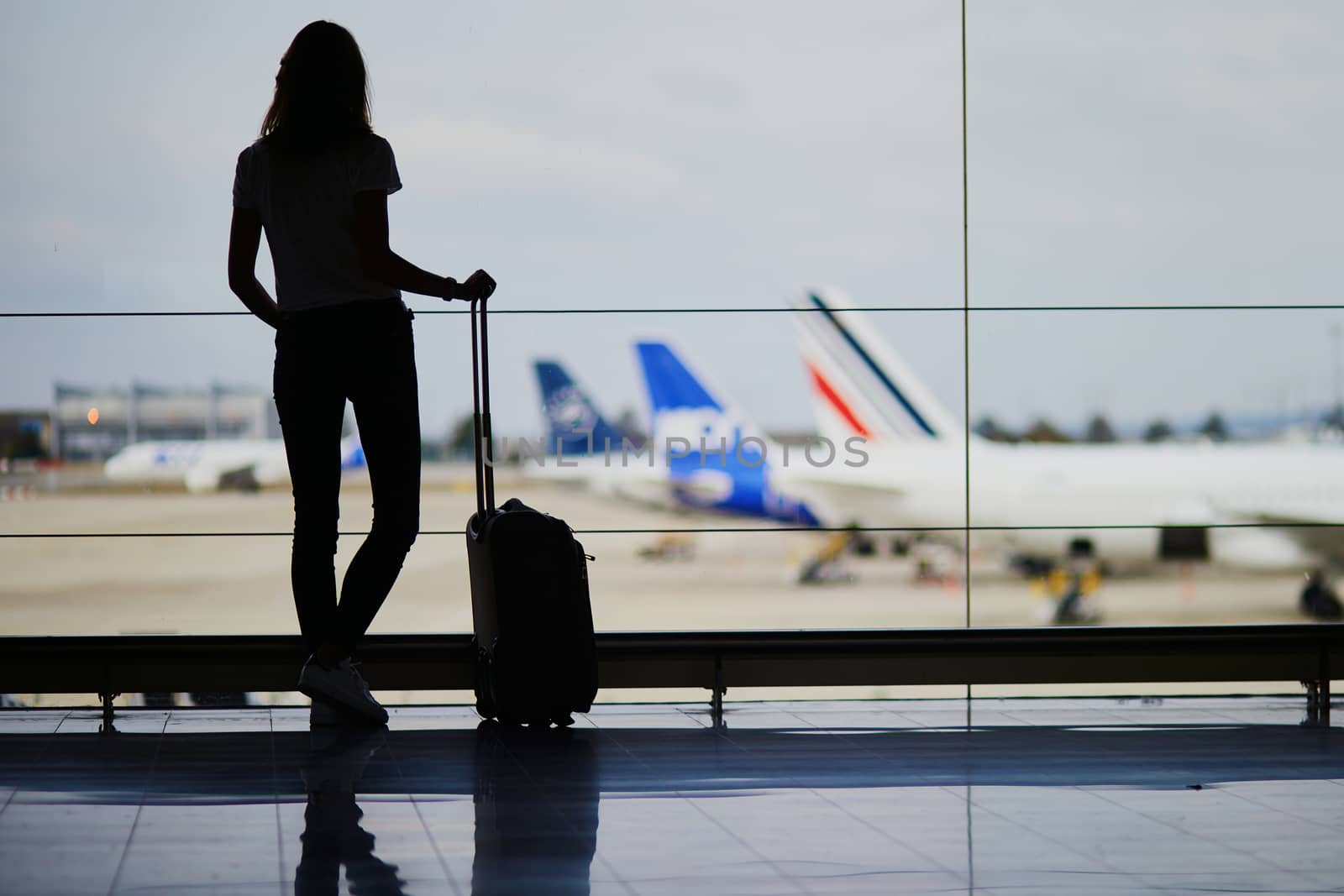 Young woman in international airport by jaspe