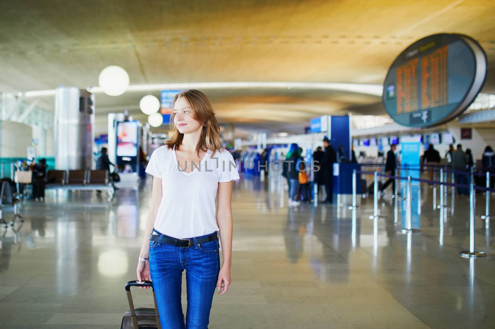 Young woman in international airport by jaspe