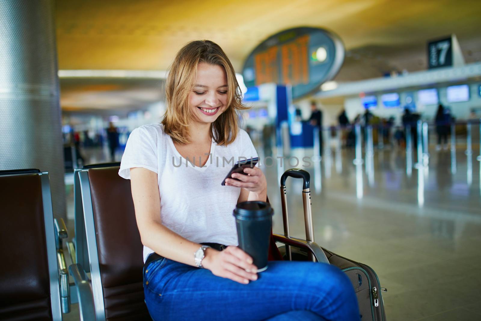 Young woman in international airport by jaspe