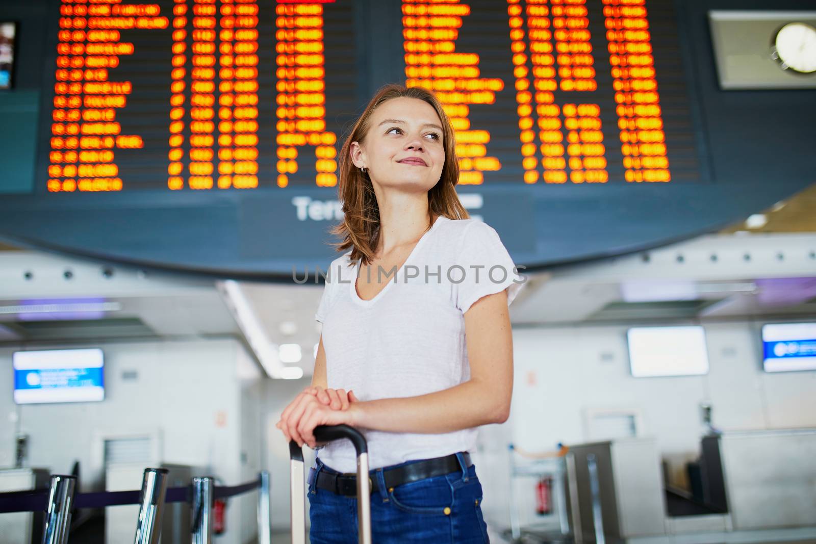 Young woman in international airport by jaspe