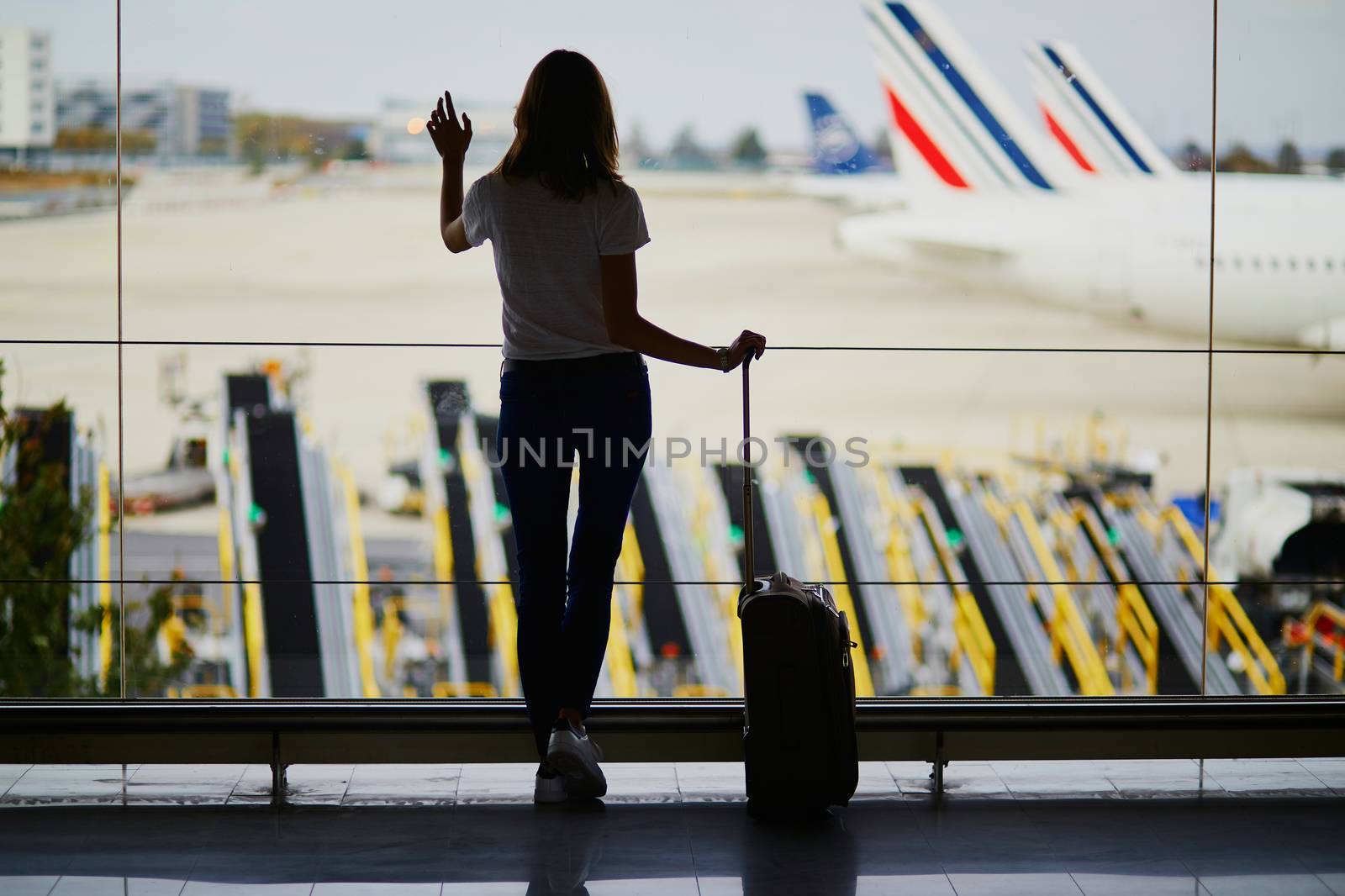 Young woman in international airport by jaspe