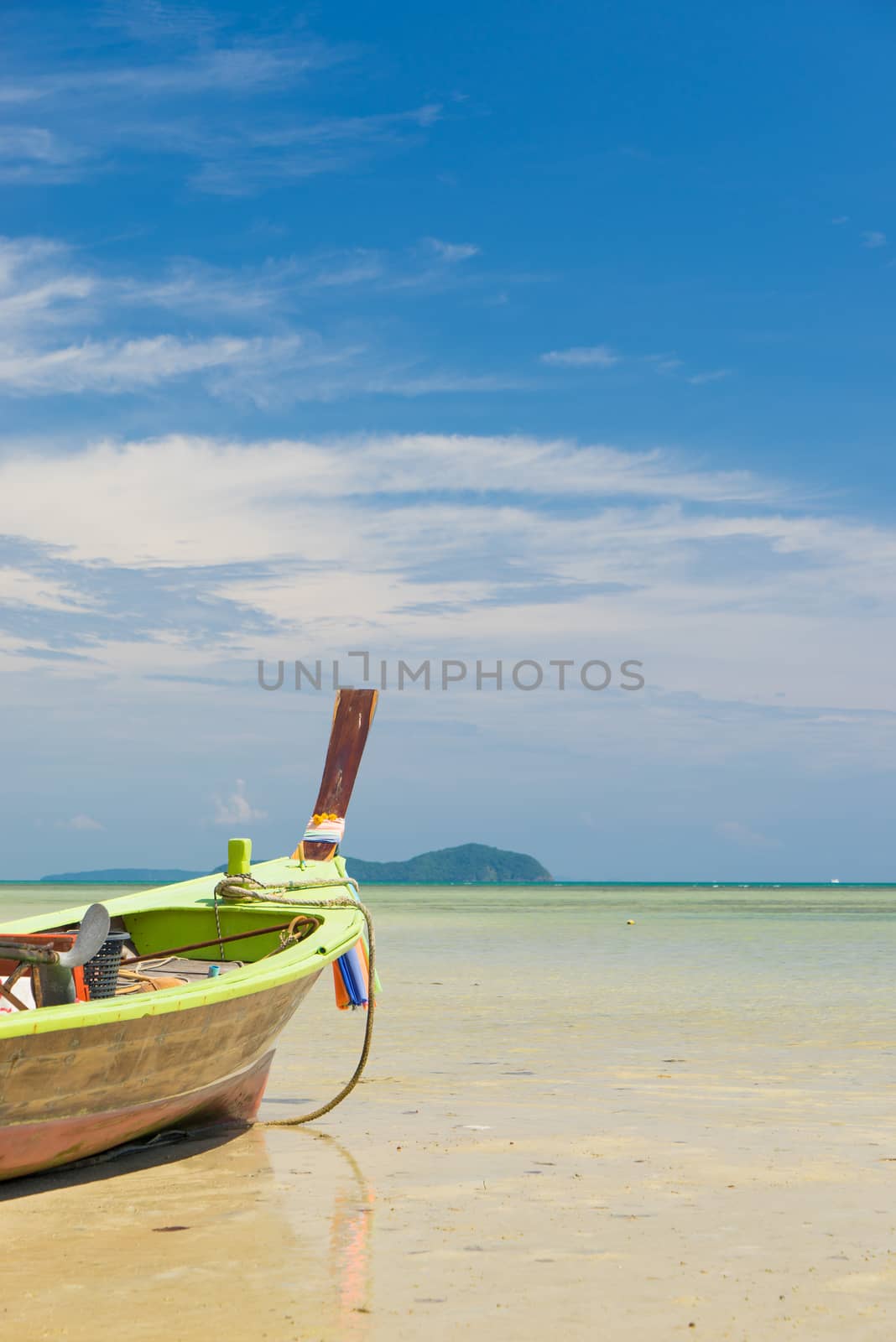 Traditional thai longtail boat at famous sunny Long Beach by Netfalls