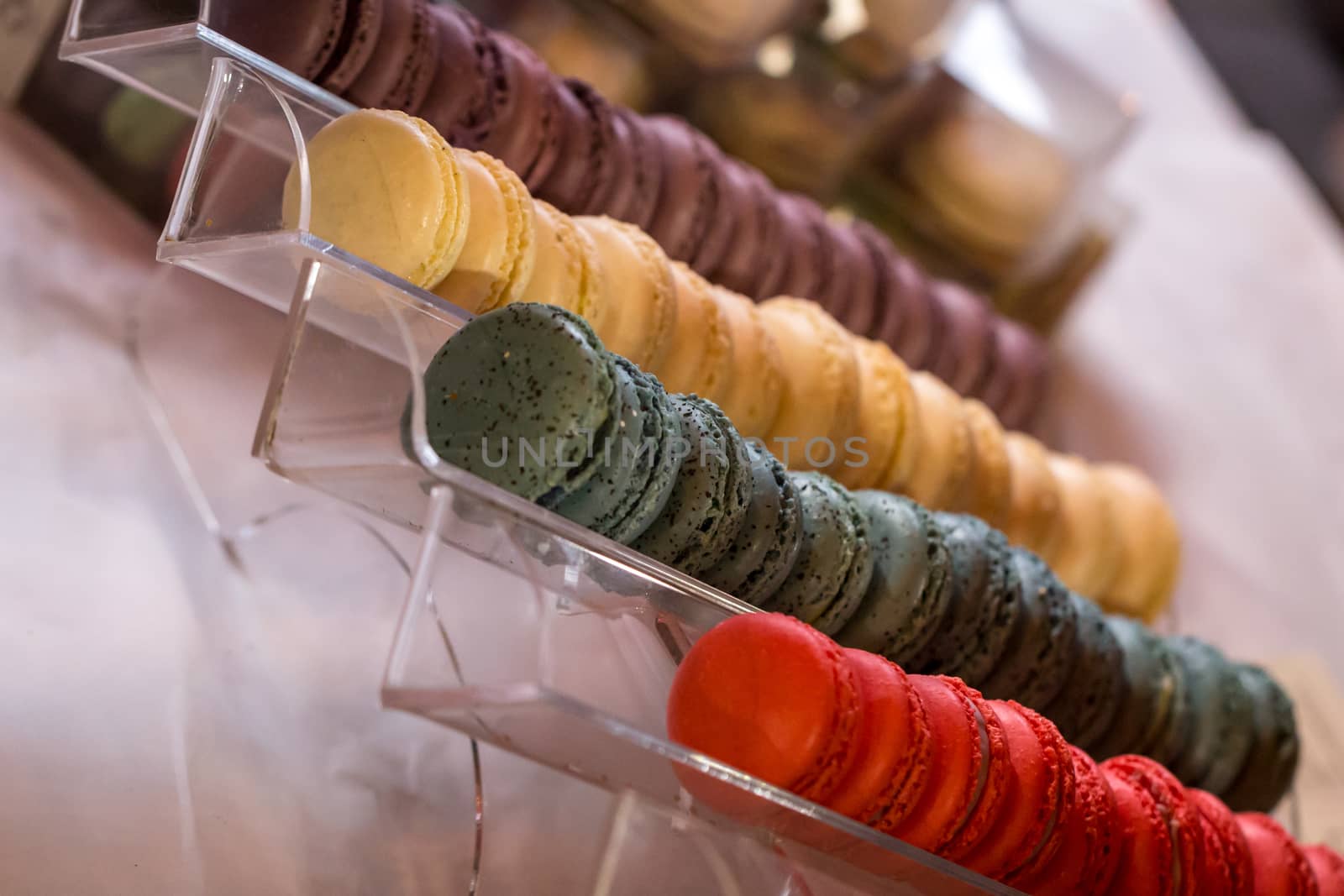 Colorful Macaroons on a market stall by magicbones