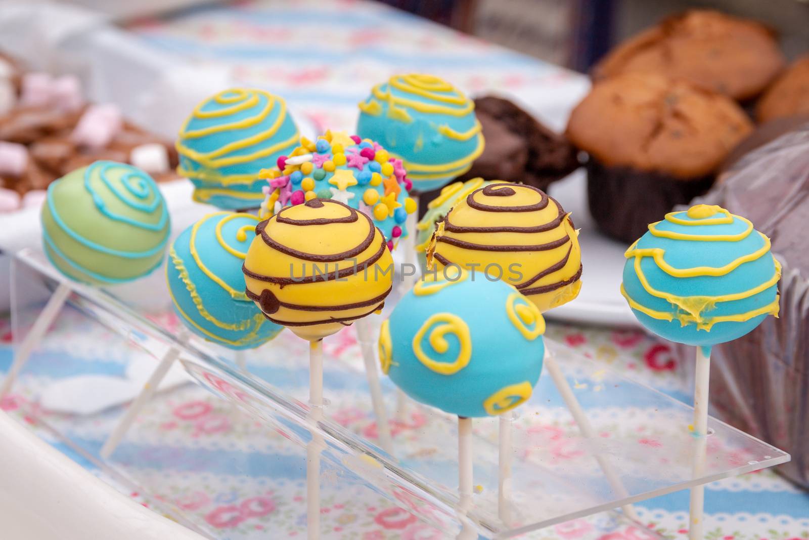 Variety of colorful hand made lollipops on a stand in a London market stall