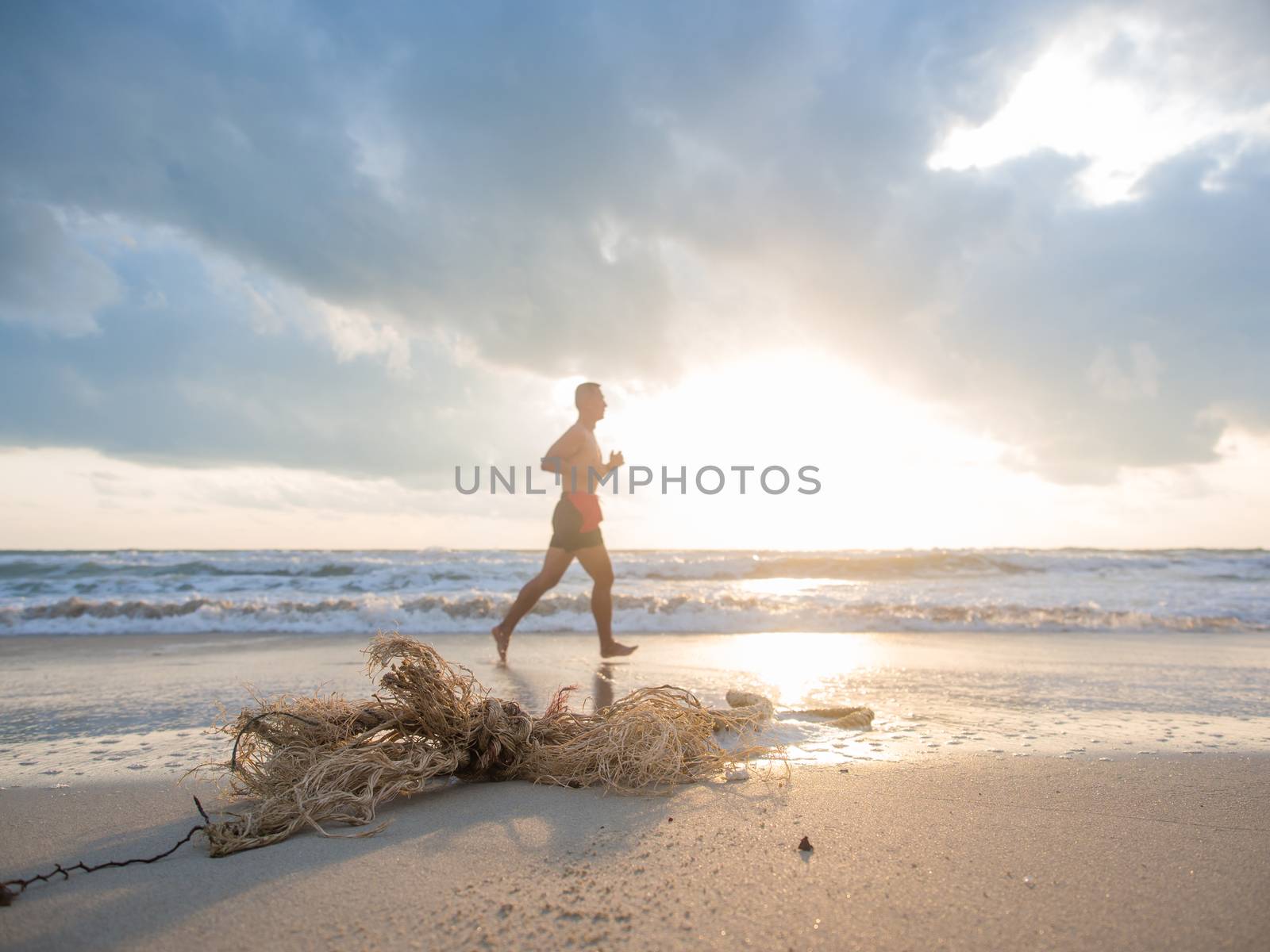 Rope on the beach with man running on background in Koh Samui island, Thailand.