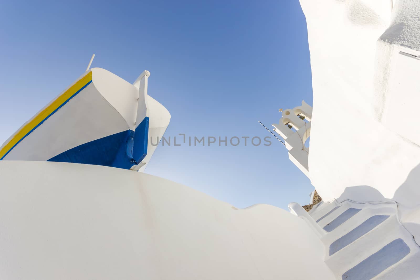 Old fishing row boat on the roof in Oia, Santorini island, Greere