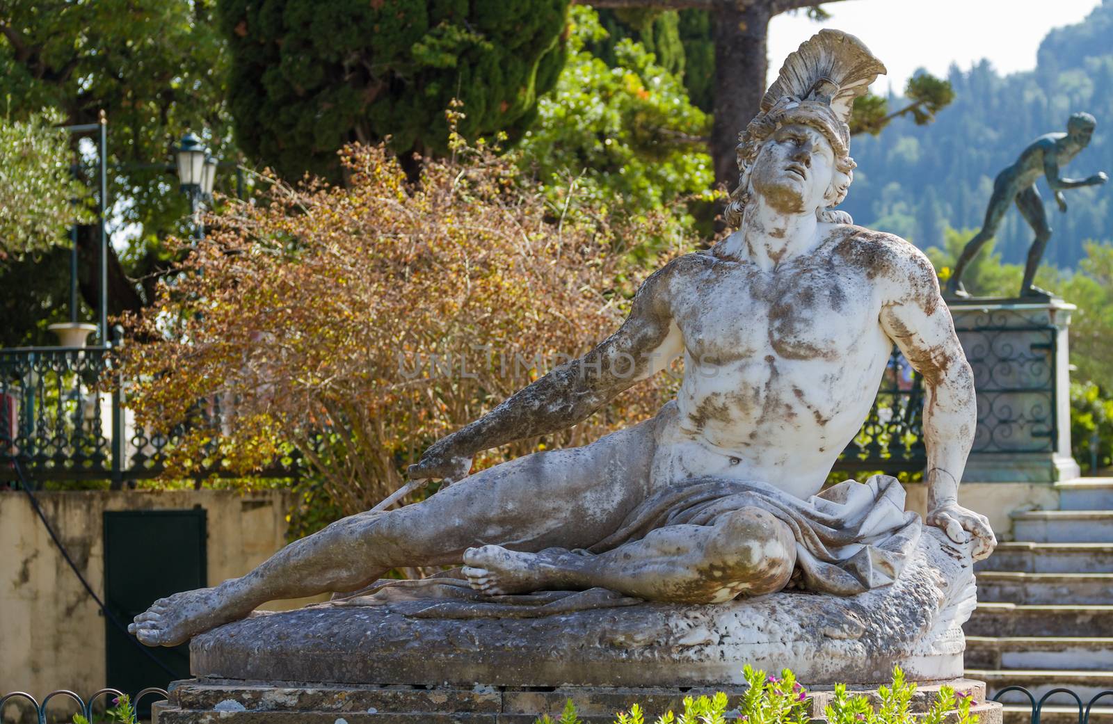 Famous statue Wounded Achilles in the garden of Achillion palace by Netfalls