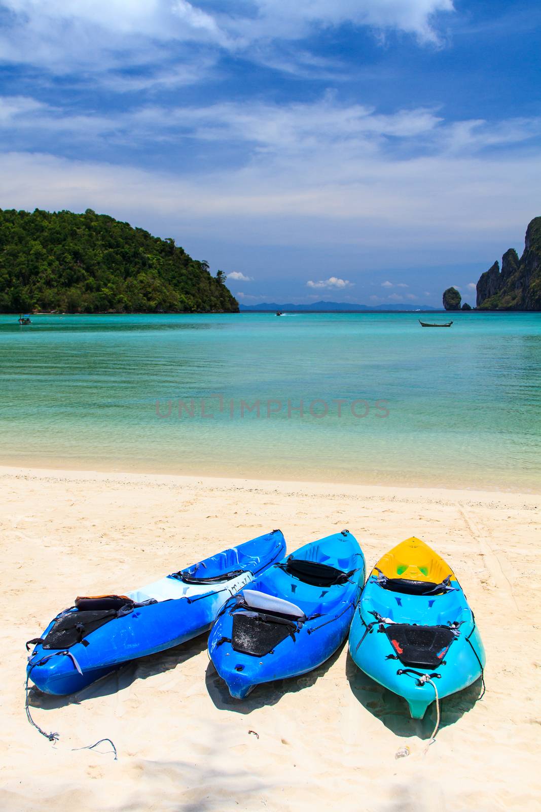 kayaks at the tropical beach Kingdom Thailand by Netfalls