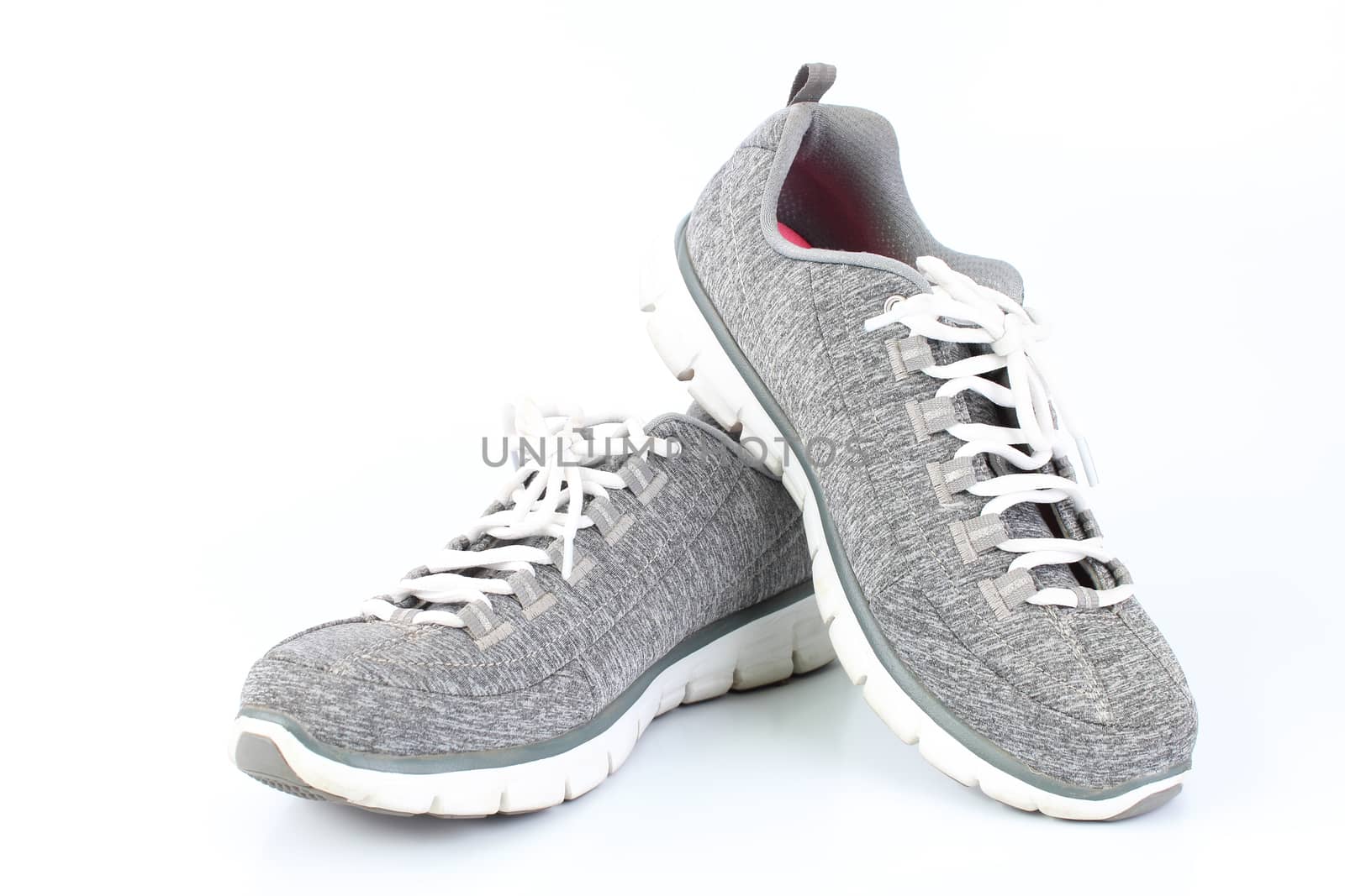 Gray sneakers with red laces on a white background by Mizkit